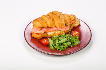 Croissant with salmon for breakfast