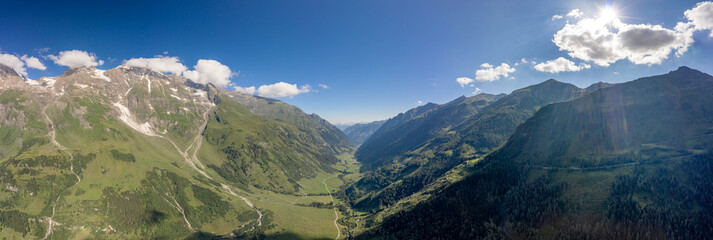 Panoramic aerial view of Taxenbacher Fusch high alpine road in Grossglockner mountain valley in Austria summer