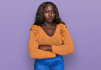 Young african woman wearing casual clothes skeptic and nervous, disapproving expression on face...