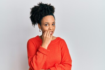 Young african american girl wearing casual clothes looking stressed and nervous with hands on mouth biting nails. anxiety problem.