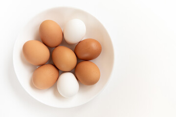Group brown fresh eggs, isolated on white background.