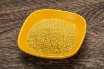 Raw cous cous heap in the bowl