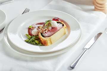 Easter meat roll, meatloaf for Easter dinner. Beautifully decorated catering banquet table with different food snacks and appetizers