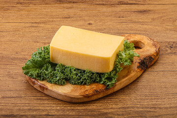 Tasty yelloow Tilsiter cheese brick