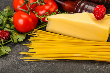Raw Italian spaghetti heap with cheese