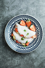 Brazilian Stuffed Tapioca crepes. Flatbread made from cassava with strawberry and banana.