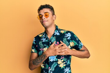 Young handsome african american man wearing summer style smiling with hands on chest, eyes closed with grateful gesture on face. health concept.