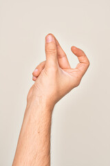 Hand of caucasian young man showing fingers over isolated white background snapping fingers for success, easy and click symbol gesture with hand