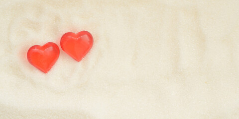 Obraz na płótnie Canvas Two love valentine day hearts on sweet sugar background.
