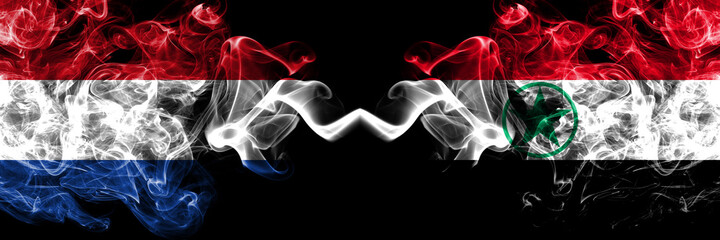 Netherlands vs Arabistan, Democratic Revolutionary Front for the Liberation of Arabistan smoky mystic flags placed side by side. Thick colored silky abstract smoke flags.