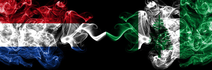 Netherlands vs Australia, Australian, Norfolk Island smoky mystic flags placed side by side. Thick colored silky abstract smoke flags.