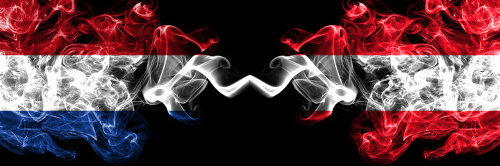 Netherlands vs Austria, Austrian smoky mystic flags placed side by side. Thick colored silky abstract smoke flags.