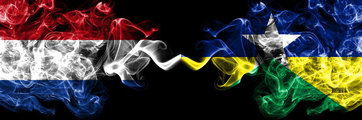 Netherlands vs Brazil, Brazilian, Rondonia  smoky mystic flags placed side by side. Thick colored silky abstract smoke flags.