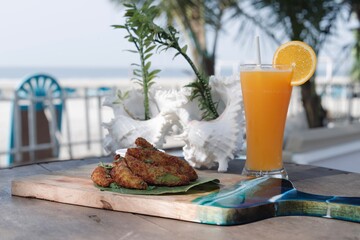 breakfast on the beach deep fried avocado and orange juice 
