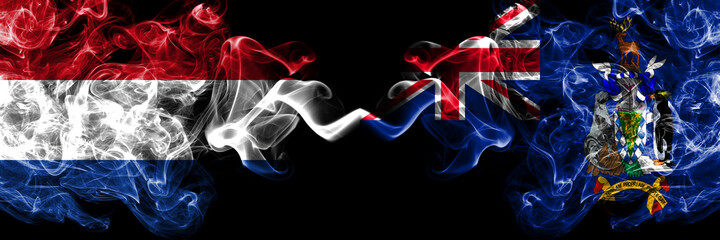 Netherlands vs British, Britain, South Georgia and the South Sandwich Islands smoky mystic flags placed side by side. Thick colored silky abstract smoke flags.