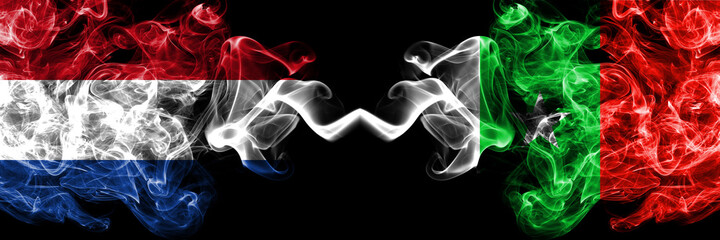 Netherlands vs Casamance, Senegal  smoky mystic flags placed side by side. Thick colored silky abstract smoke flags.