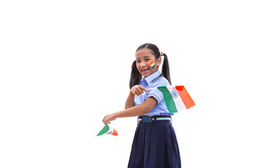 young school girl with flag drawn on her cheeks and holding flags in her hand , independence day	