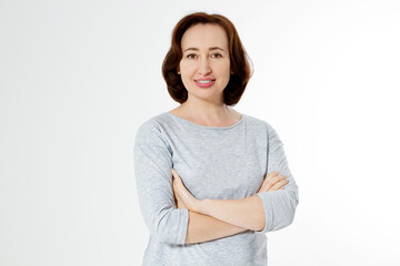 Obraz premium Middle aged woman healthy and happy lifestyle after menopause. Beautiful close up portrait mid age brunette woman. female isolated on white background with copy space. Menopausal and healthcare.