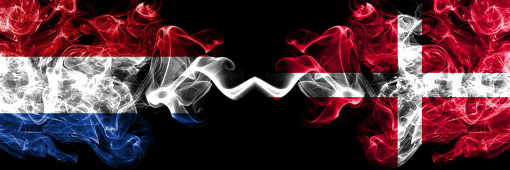 Netherlands vs Denmark, Danish smoky mystic flags placed side by side. Thick colored silky abstract smoke flags.