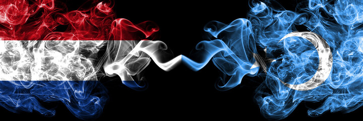Netherlands vs East Turkestan, Uyghurs, Uyghur smoky mystic flags placed side by side. Thick colored silky abstract smoke flags.