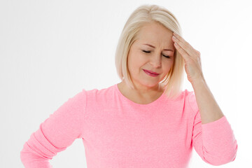Women Hormonal Headaches. Closeup Middle aged woman with Menopause migraines isolated on white...