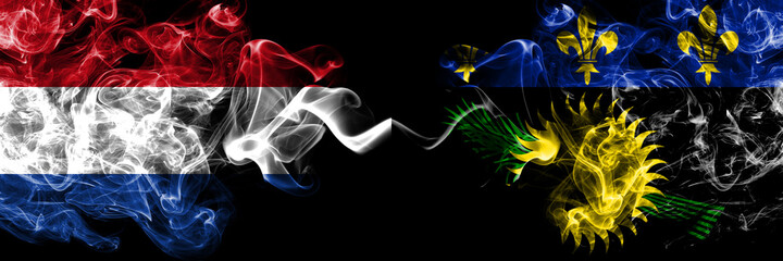 Netherlands vs France, French, Guadeloupe smoky mystic flags placed side by side. Thick colored silky abstract smoke flags.