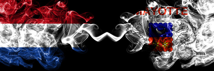 Netherlands vs France, French, Mayotte smoky mystic flags placed side by side. Thick colored silky abstract smoke flags.