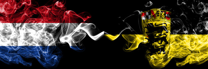 Netherlands vs Germany, German, Deutschland, Baden Wurttemberg smoky mystic flags placed side by side. Thick colored silky abstract smoke flags.