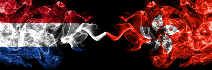 Netherlands vs Hong Kong, China, Chinese smoky mystic flags placed side by side. Thick colored silky abstract smoke flags.