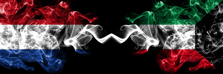 Netherlands vs Kuwait, Kuwaiti smoky mystic flags placed side by side. Thick colored silky abstract smoke flags.