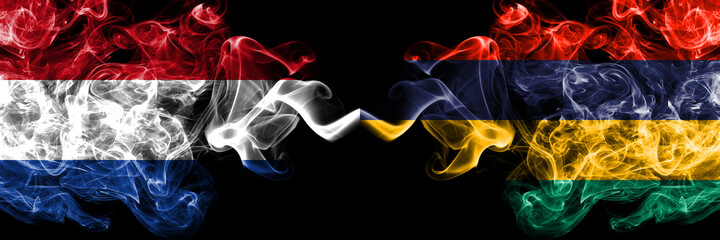 Netherlands vs Mauritius smoky mystic flags placed side by side. Thick colored silky abstract smoke flags.