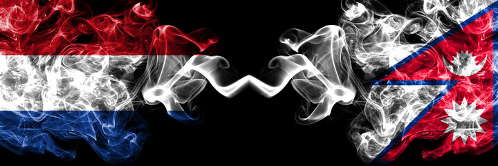 Netherlands vs Nepal, Nepali, Nepalese smoky mystic flags placed side by side. Thick colored silky abstract smoke flags.