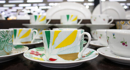 Tea sets in the store. Cups and saucers
