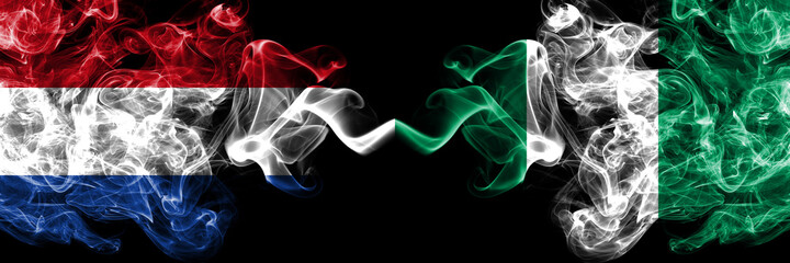 Netherlands vs Nigeria, Nigerian smoky mystic flags placed side by side. Thick colored silky abstract smoke flags.