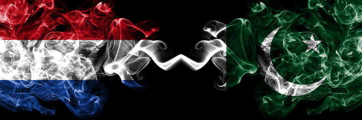 Netherlands vs Pakistan, Pakistani smoky mystic flags placed side by side. Thick colored silky abstract smoke flags.