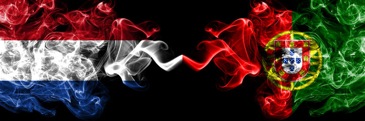 Netherlands vs Portugal, Portuguese smoky mystic flags placed side by side. Thick colored silky abstract smoke flags.