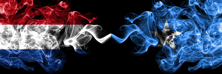 Netherlands vs Somalia, Somali smoky mystic flags placed side by side. Thick colored silky abstract smoke flags.