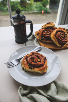 Cinnamon rolls buns on a white plate simple background 