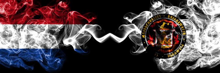 Netherlands vs United States of America, America, US, USA, American, Bridgewater, Massachusetts smoky mystic flags placed side by side. Thick colored silky abstract smoke flags.