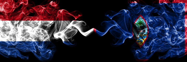 Netherlands vs United States of America, America, US, USA, American, Guam smoky mystic flags placed side by side. Thick colored silky abstract smoke flags. - obrazy, fototapety, plakaty