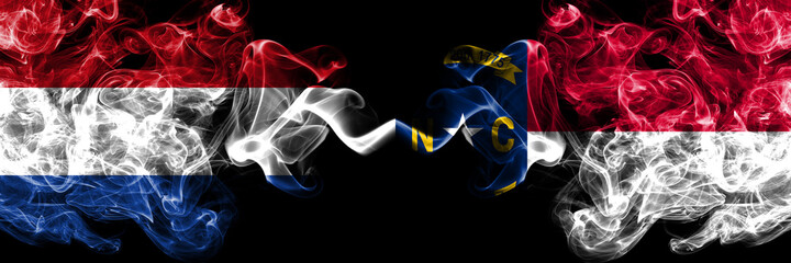 Netherlands vs United States of America, America, US, USA, American, North Carolina smoky mystic flags placed side by side. Thick colored silky abstract smoke flags.