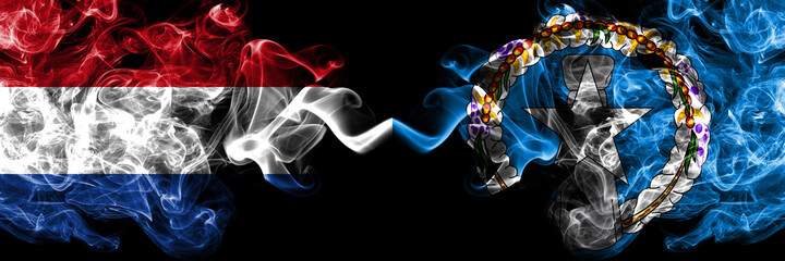 Netherlands vs United States of America, America, US, USA, American, Northern Mariana Islands smoky mystic flags placed side by side. Thick colored silky abstract smoke flags.