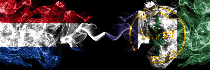 Netherlands vs United States of America, America, US, USA, American, Palo Alto, California smoky mystic flags placed side by side. Thick colored silky abstract smoke flags.
