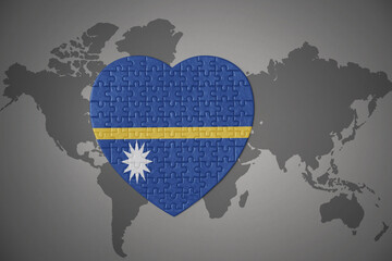 puzzle heart with the national flag of Nauru on a world map background.