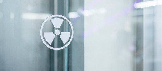 Radiation zone sign sticker on window of laboratory room. Health and safety concept - obrazy, fototapety, plakaty