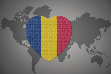 puzzle heart with the national flag of chad on a world map background.