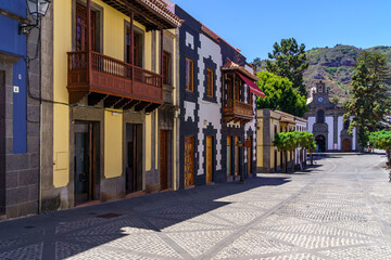 Main street of the charming town of Teror in Gran Canaria with colorful houses and church in the main square. Spain.