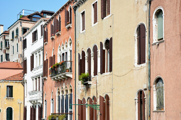 Fototapeta na wymiar Facades of a colorful buildings in Venice Italy