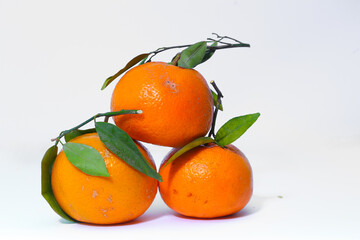 Tangerines with leaves on a white background 