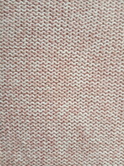 Pink knitting wool pattern background and texture